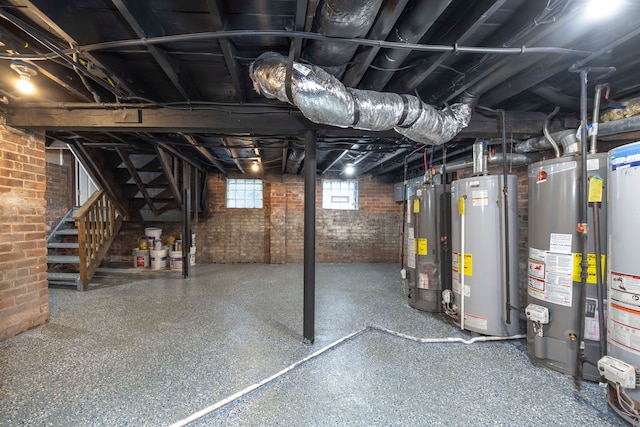 basement with gas water heater and brick wall