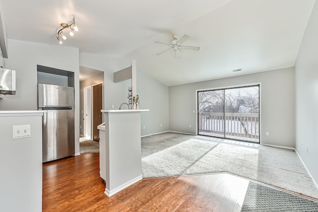 interior space featuring lofted ceiling and ceiling fan