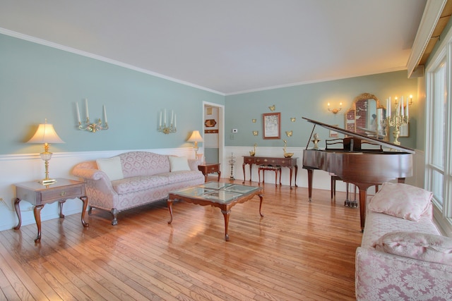 living room featuring crown molding and light wood-type flooring