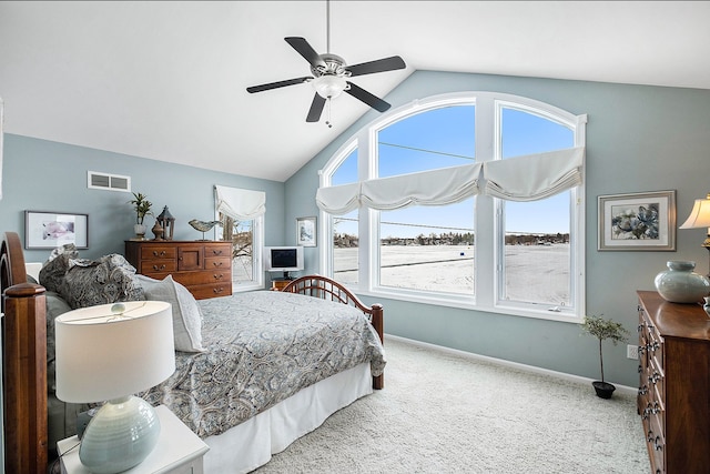 carpeted bedroom with high vaulted ceiling, a ceiling fan, visible vents, and baseboards