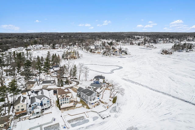 snowy aerial view with a residential view