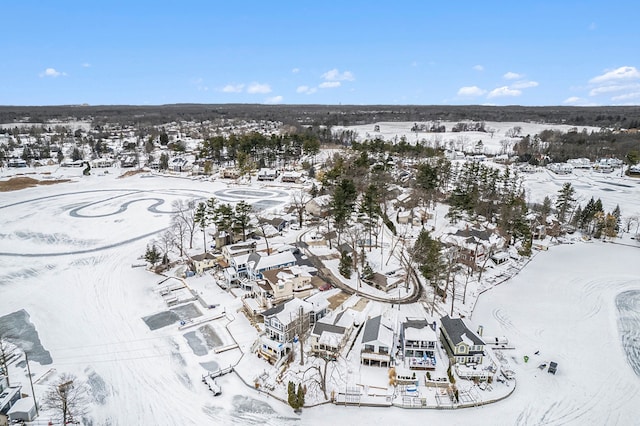 snowy aerial view featuring a residential view