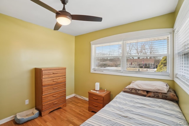 bedroom featuring light hardwood / wood-style flooring and ceiling fan