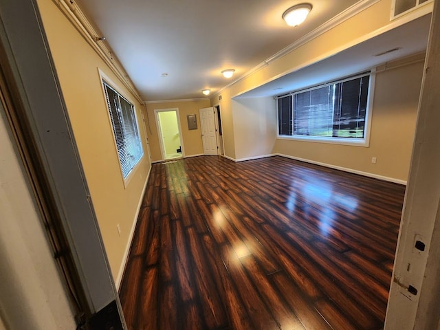 empty room featuring crown molding and hardwood / wood-style floors