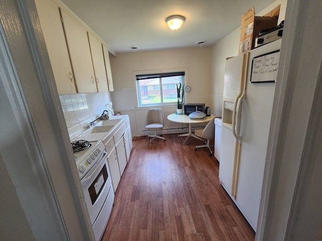 kitchen featuring tasteful backsplash, white cabinetry, dark hardwood / wood-style floors, and white appliances