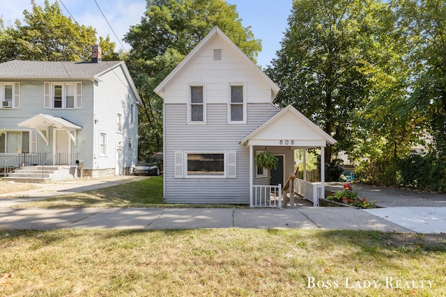 view of front of home with a front lawn