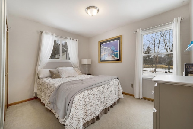 bedroom featuring light carpet