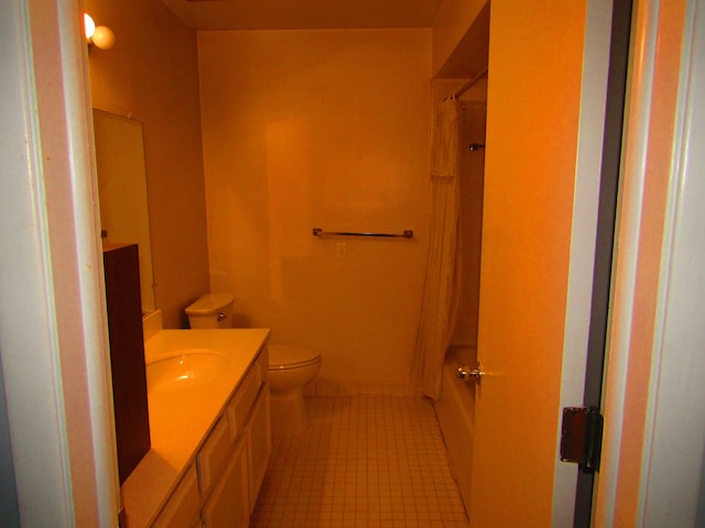 full bathroom with vanity, tile patterned floors, toilet, and shower / bath combo with shower curtain