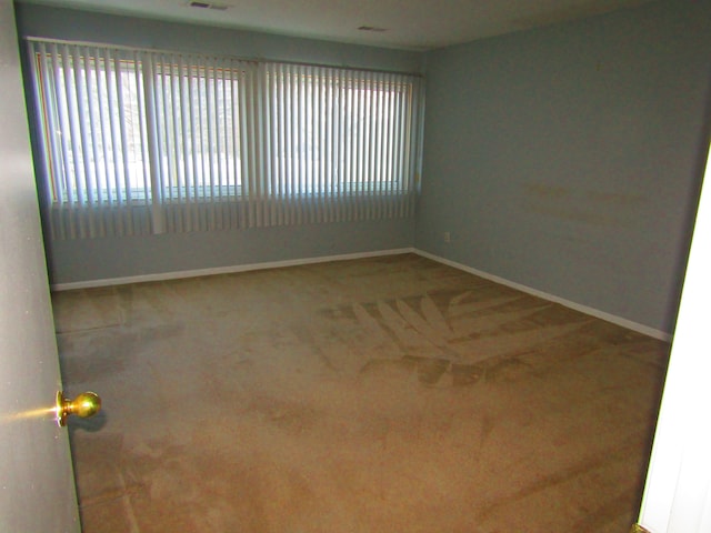 empty room featuring carpet flooring