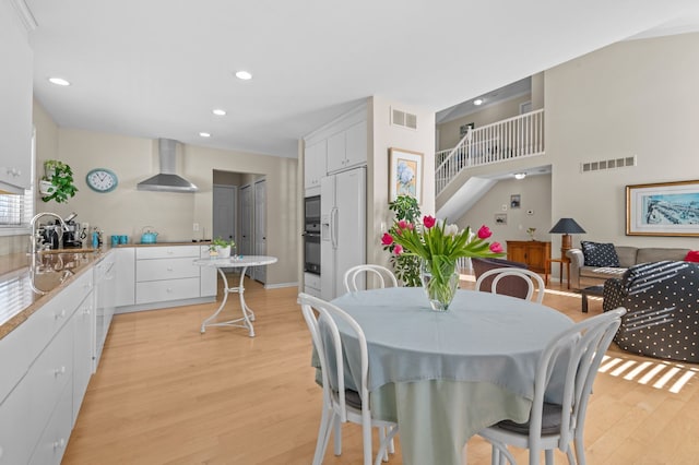 dining area featuring light hardwood / wood-style floors and sink