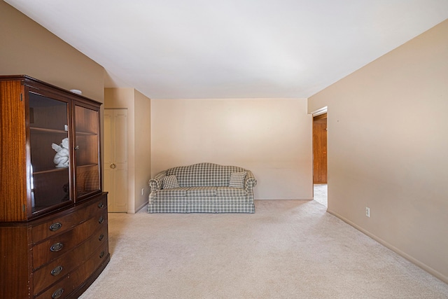 unfurnished room with light carpet