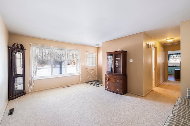 empty room featuring light colored carpet