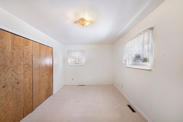 carpeted bedroom featuring a closet