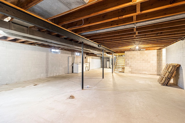 basement with washer / clothes dryer and water heater