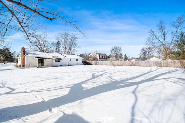 view of yard layered in snow