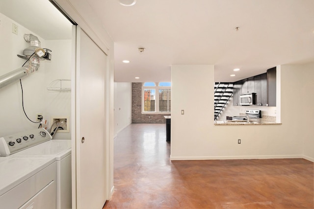 washroom with independent washer and dryer