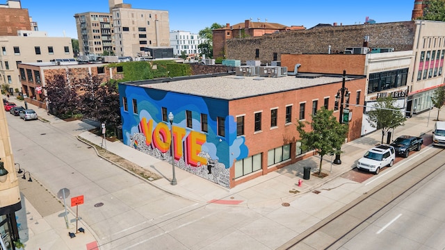 view of building exterior featuring central air condition unit