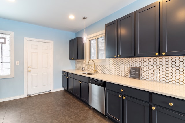 kitchen with sink, dishwasher, tasteful backsplash, a wealth of natural light, and decorative light fixtures