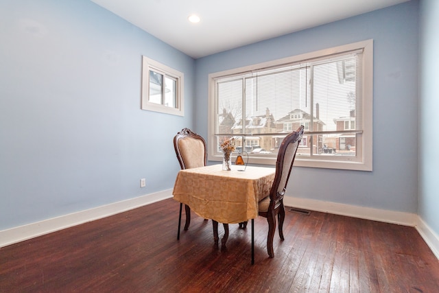 dining room with dark hardwood / wood-style floors