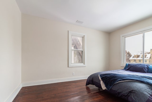 bedroom featuring dark hardwood / wood-style flooring