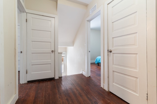 hall with dark hardwood / wood-style flooring