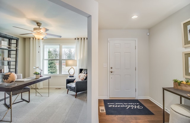 entryway with hardwood / wood-style flooring and ceiling fan