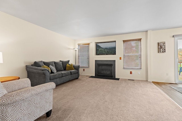 living room with light colored carpet