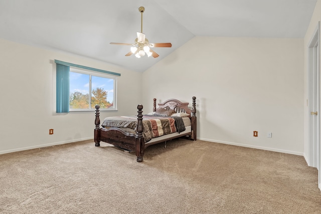 bedroom with ceiling fan, lofted ceiling, and carpet flooring