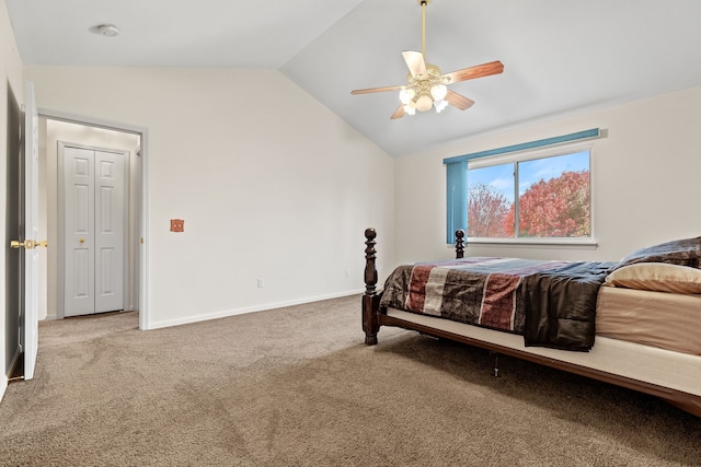 carpeted bedroom with ceiling fan and lofted ceiling