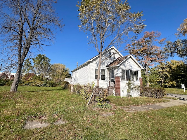 bungalow with a front lawn