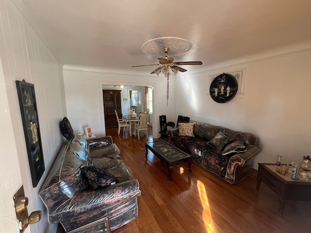 living room with dark wood-type flooring and ceiling fan