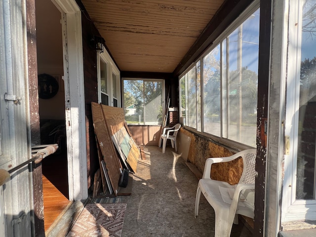 sunroom / solarium featuring wood ceiling