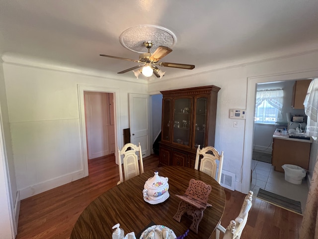 dining room featuring ceiling fan and dark hardwood / wood-style floors