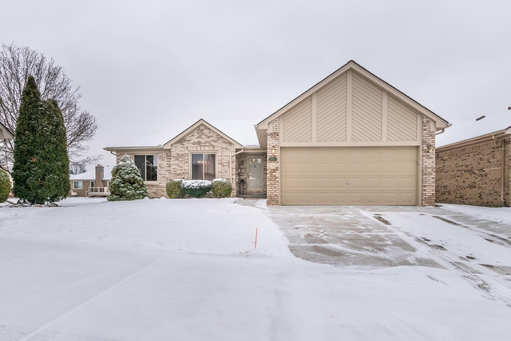 ranch-style house featuring a garage