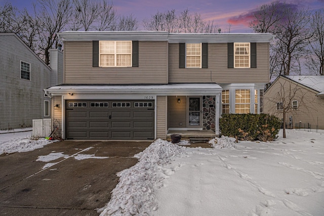 front facade with a garage