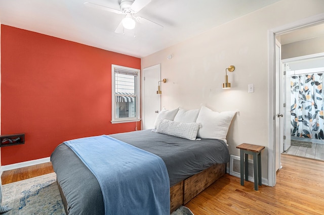 bedroom with ceiling fan and light wood-type flooring