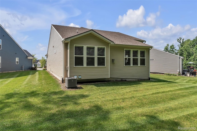 4633 Crestway Dr, Brighton, MI 48116 - back of house with a yard and a shingled roof