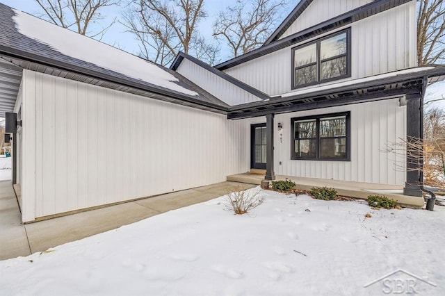 view of snow covered property entrance