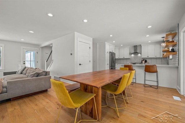 dining room with light wood-type flooring