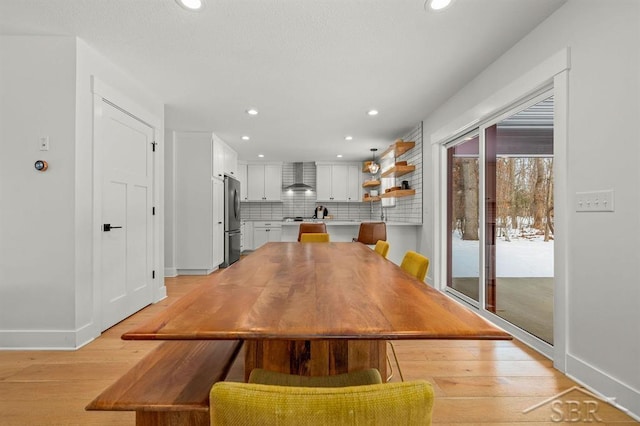 unfurnished dining area with light wood-type flooring