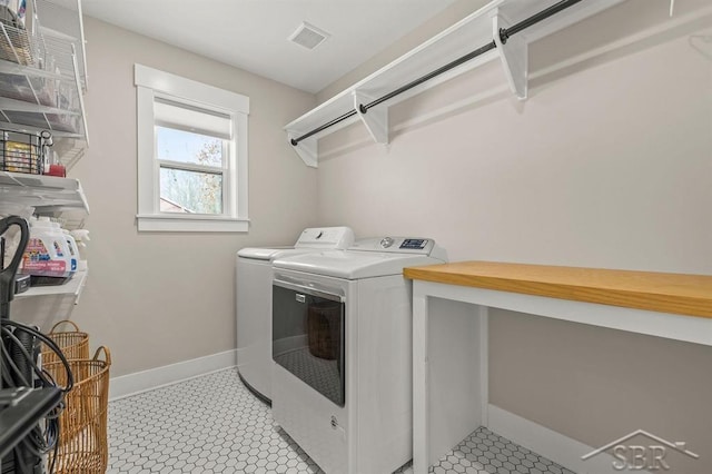 clothes washing area featuring washer and dryer