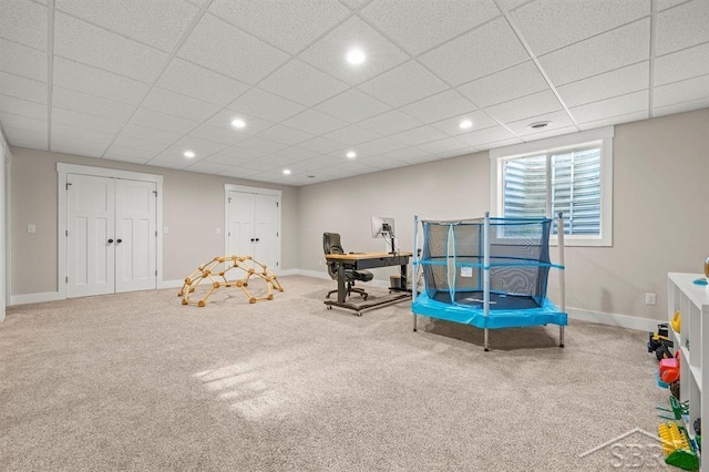 game room featuring a drop ceiling and carpet flooring