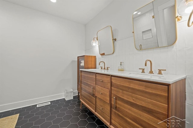 bathroom with tile patterned floors and vanity