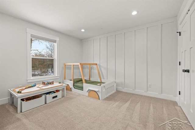 playroom featuring light colored carpet