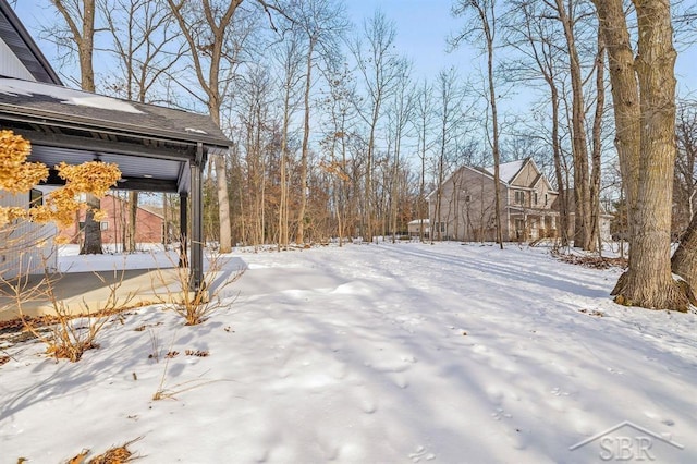 view of yard covered in snow