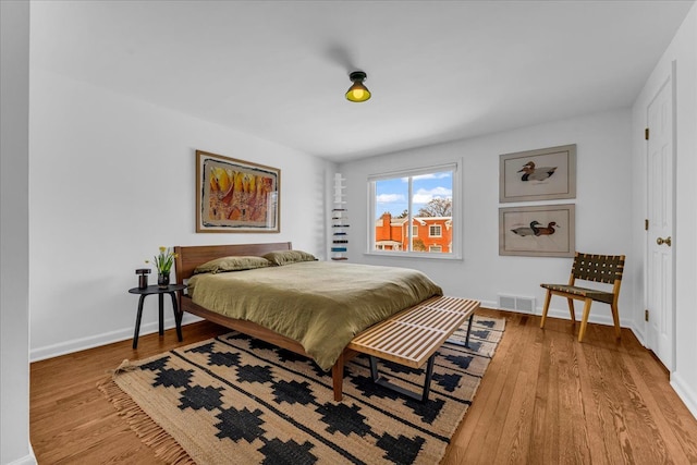 bedroom featuring wood-type flooring