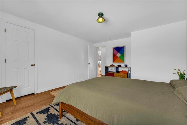 bedroom with wood-type flooring