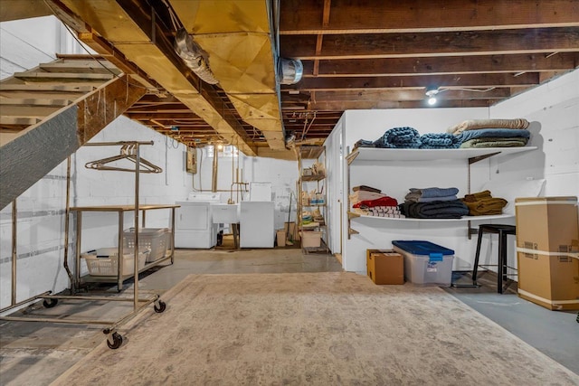 basement featuring sink and washer and clothes dryer