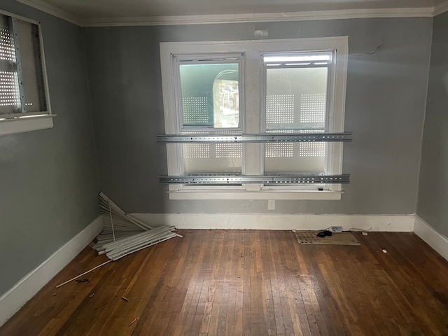 unfurnished room with crown molding and dark hardwood / wood-style floors