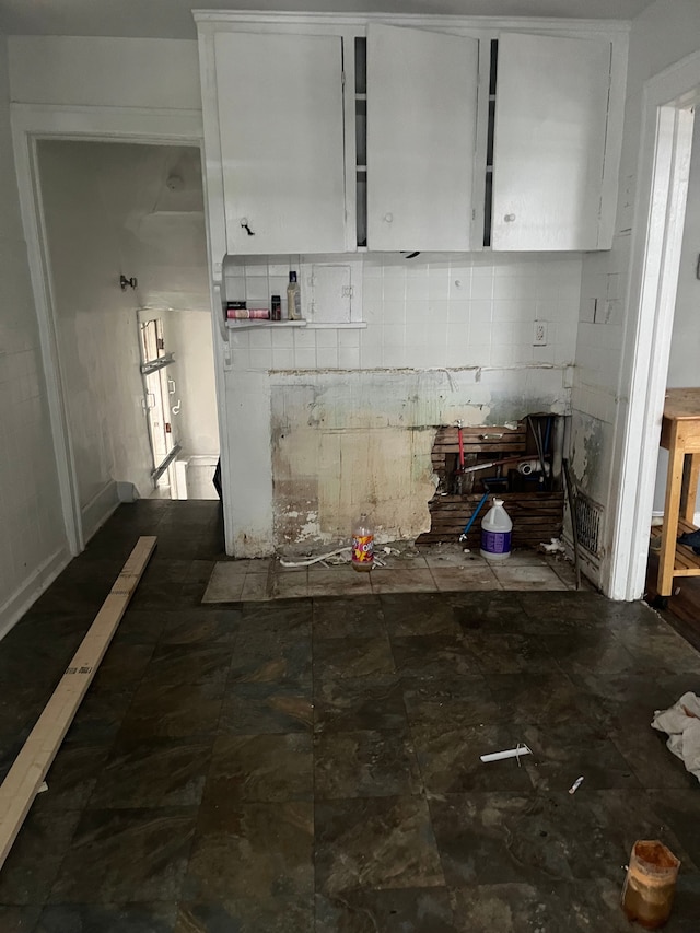 kitchen featuring white cabinets